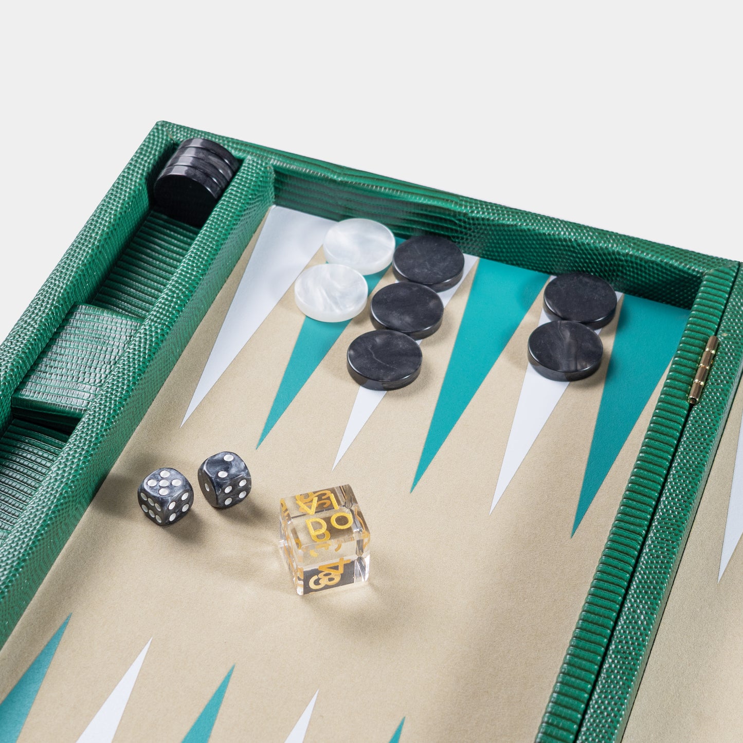 Backgammon set with pieces and dice on a green board by VIDO