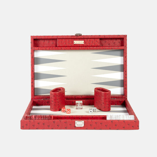 Red backgammon set with pieces and dice on a white background by VIDO