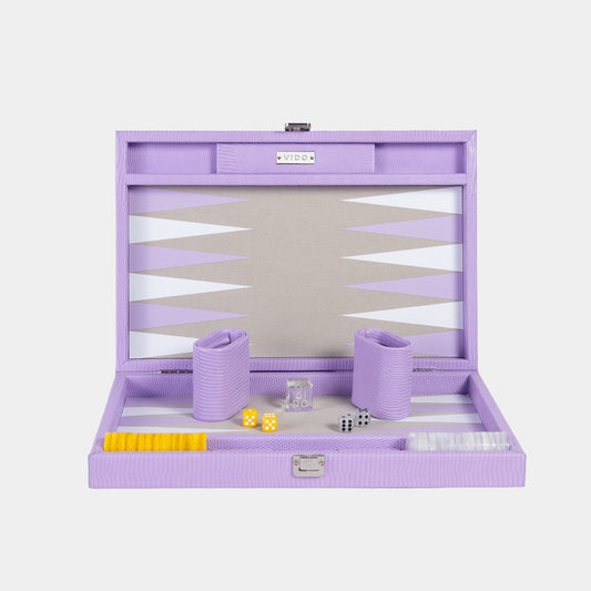 Purple backgammon set with pieces and dice on a white background by VIDO