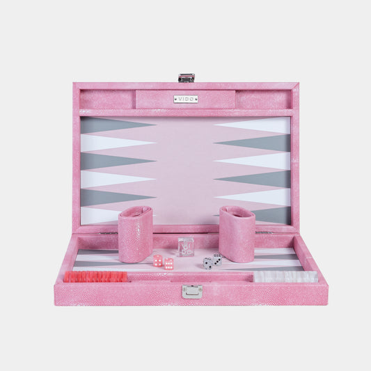 Pink backgammon set with pieces and dice on a white background by VIDO